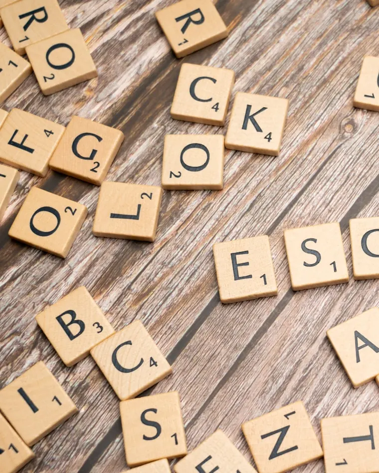 Scrabble tiles spelling an anagram — the same letters the solver unscrambles into LISTEN and SILENT