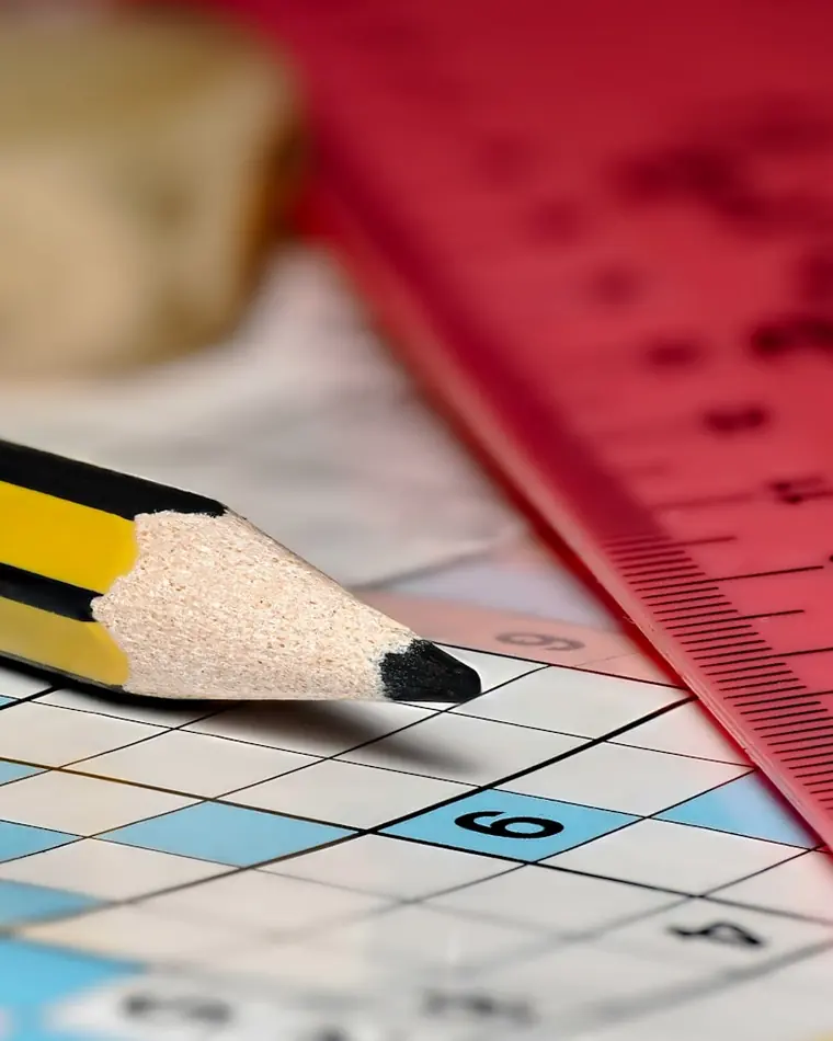 A pencil over a newspaper puzzle — the kind of daily Jumble a Jumble solver cracks